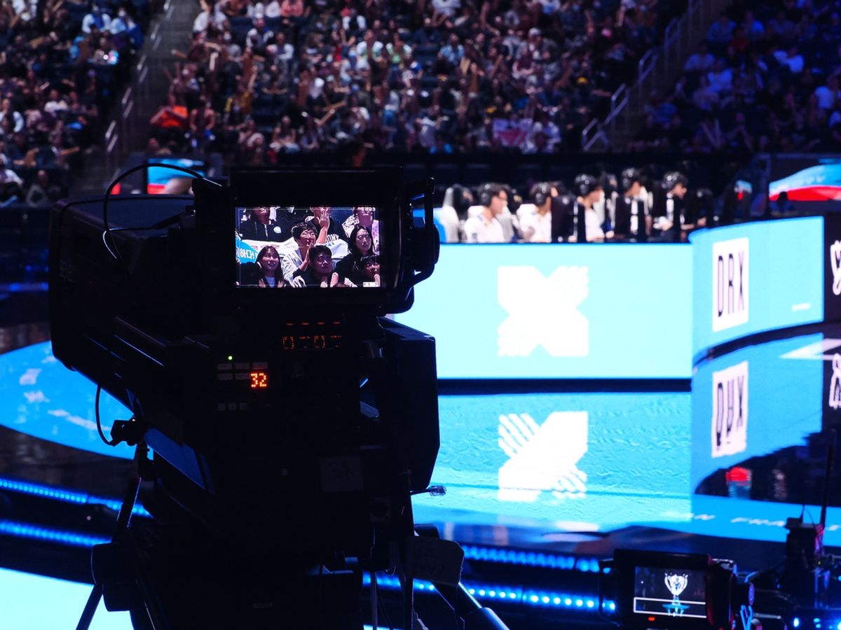 Nov 5, 2022; San Francisco, California, USA; A camera follow fans with DRX in the background during the League of Legends World Championships against T1 at Chase Center. Mandatory Credit: Kelley L Cox-Imagn Images