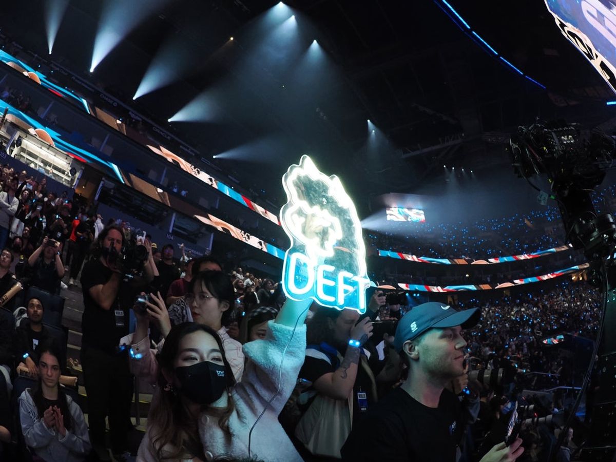 Nov 5, 2022; San Francisco, California, USA; A fan holds a sign for DRX bot laner Kim \"Deft\" Hyuk-kyu (not pictured) after winning the League of Legends World Championships against T1 at Chase Center. Mandatory Credit: Kelley L Cox-Imagn Images