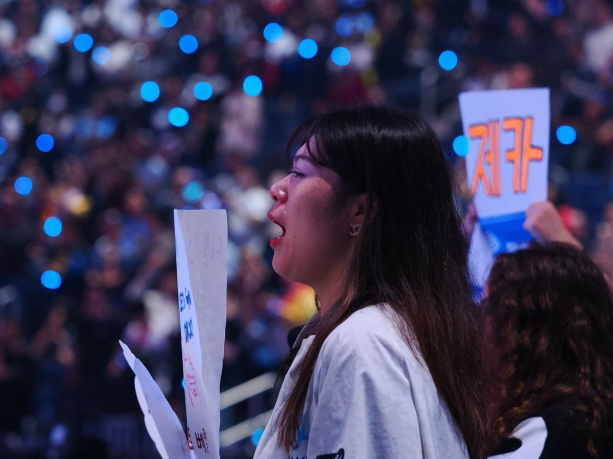 Nov 5, 2022; San Francisco, California, USA;  A DRX fan with visible tears after DRX won the League of Legends World Championships against T1 at Chase Center. Mandatory Credit: Kelley L Cox-Imagn Images