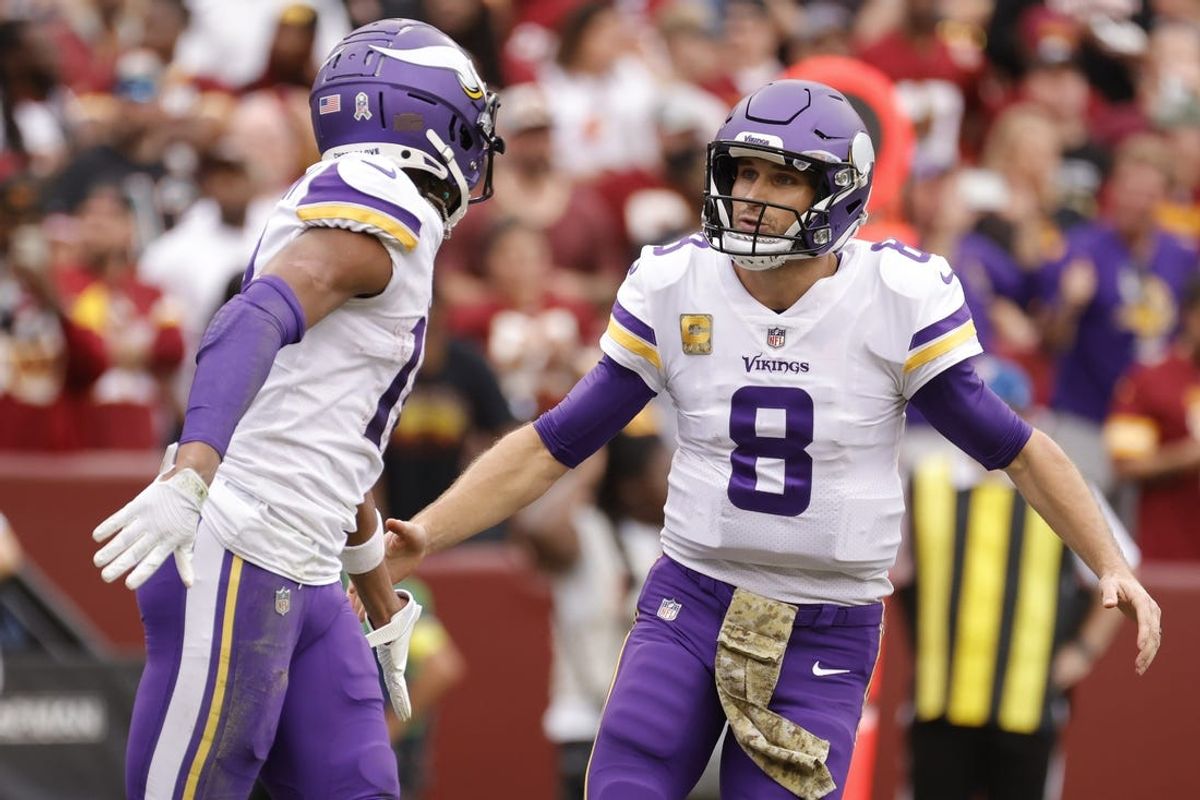 Nov 6, 2022; Landover, Maryland, USA; Minnesota Vikings wide receiver Justin Jefferson (18) celebrates with Vikings quarterback Kirk Cousins (8) after connecting on a touchdown pass against the Washington Commandersduring the first quarter at FedExField. Mandatory Credit: Geoff Burke-USA TODAY Sports