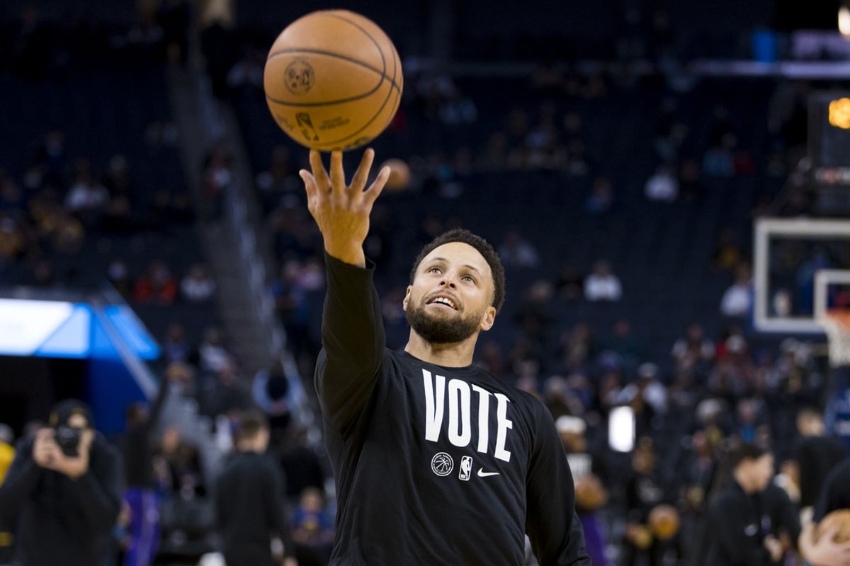 Nov 7, 2022; San Francisco, California, USA;  Golden State Warriors guard Stephen Curry (30) wears a Vote shirt before the game against the Sacramento Kings during the first half at Chase Center. Mandatory Credit: John Hefti-Imagn Images