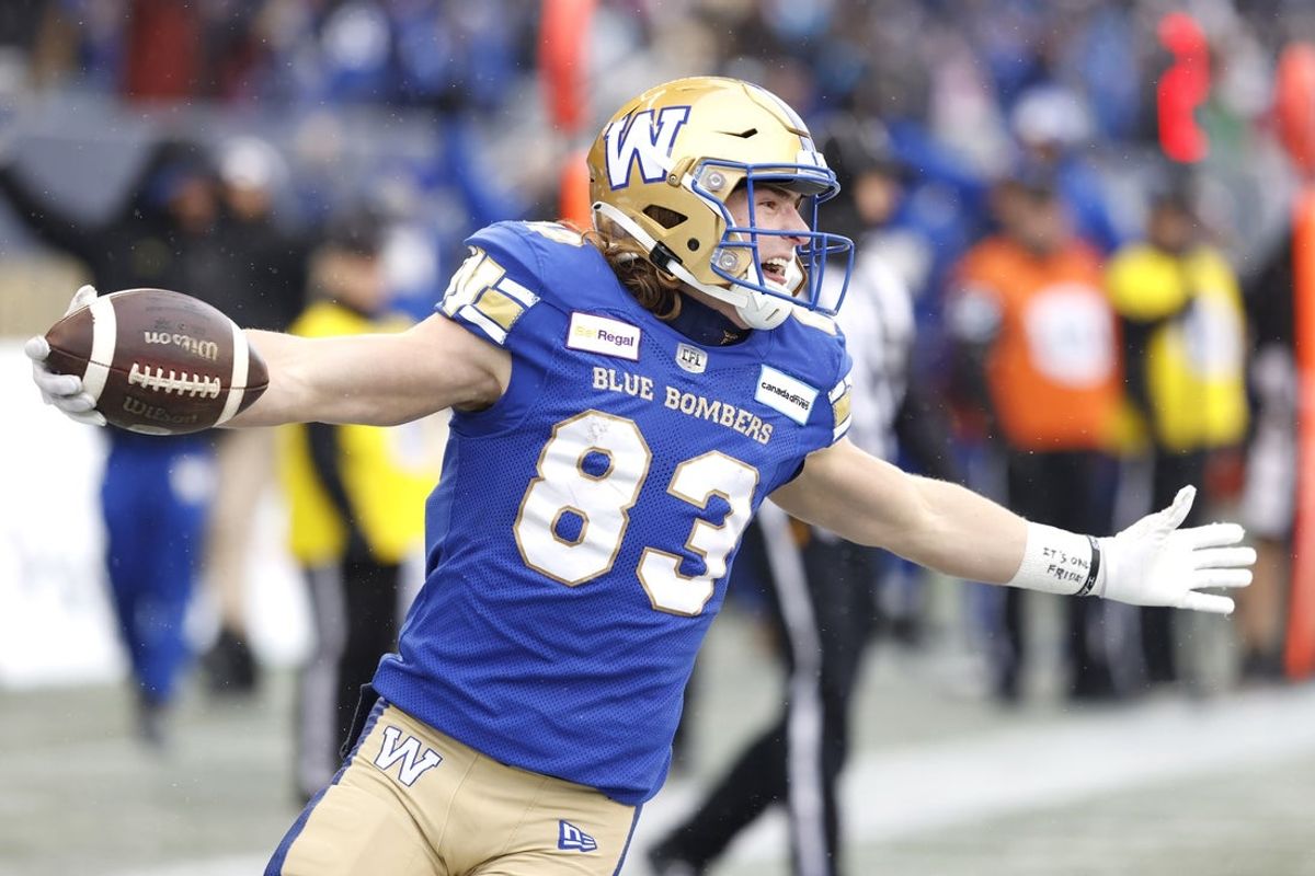 Nov 13, 2022; Winnigeg, Manitoba, CAN; Winnipeg Blue Bombers wide receiver Dalton Schoen (83) scores a touchdown in the first half against the BC Lions at Investors Group Field. Mandatory Credit: James Carey Lauder-Imagn Images
