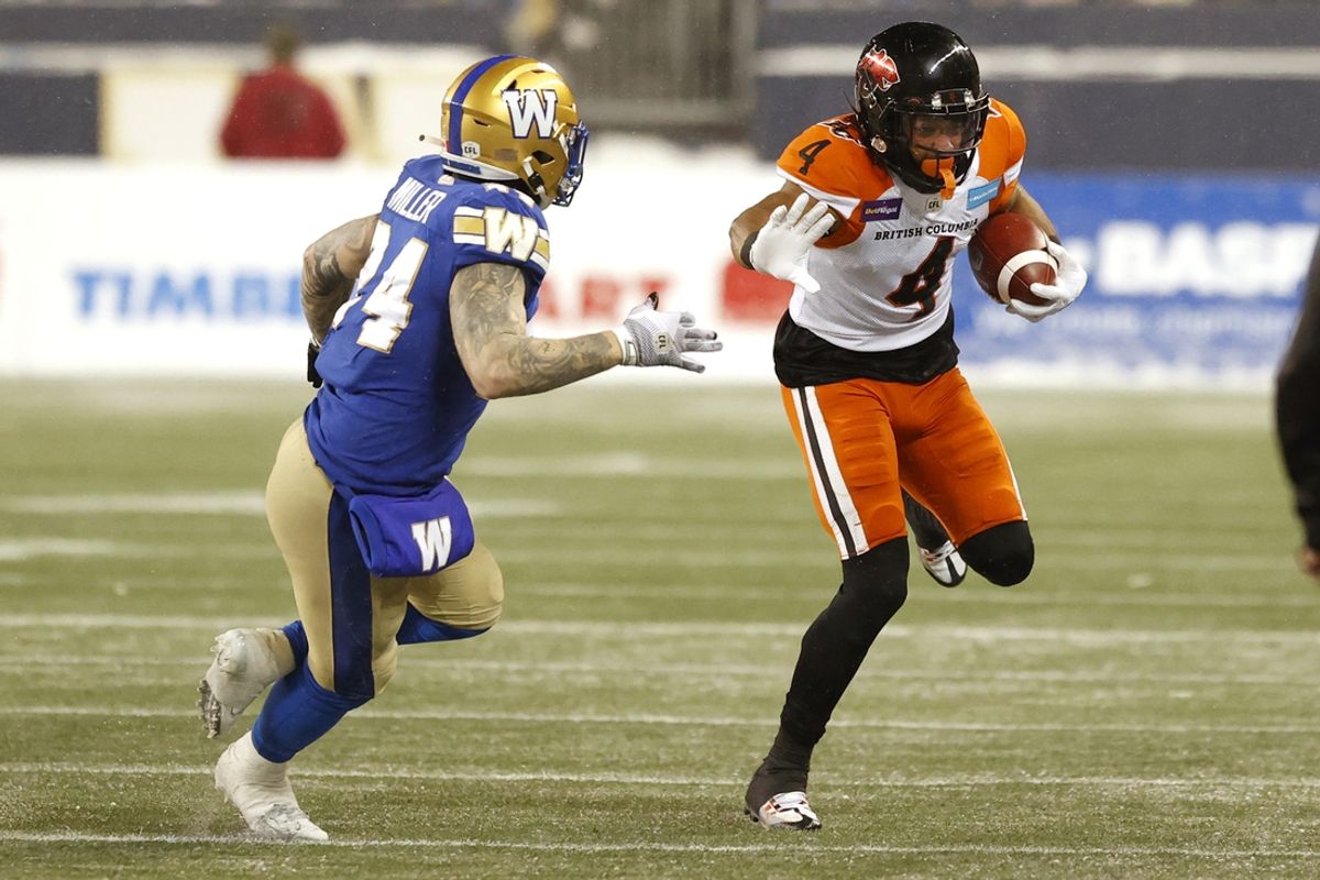 Nov 13, 2022; Winnipeg, Manitoba, CAN; Winnipeg Blue Bombers fullback Mike Miller (24) chases down BC Lions wide receiver Keon Hatcher (4) in the second period at Investors Group Field. Mandatory Credit: James Carey Lauder-USA TODAY Sports