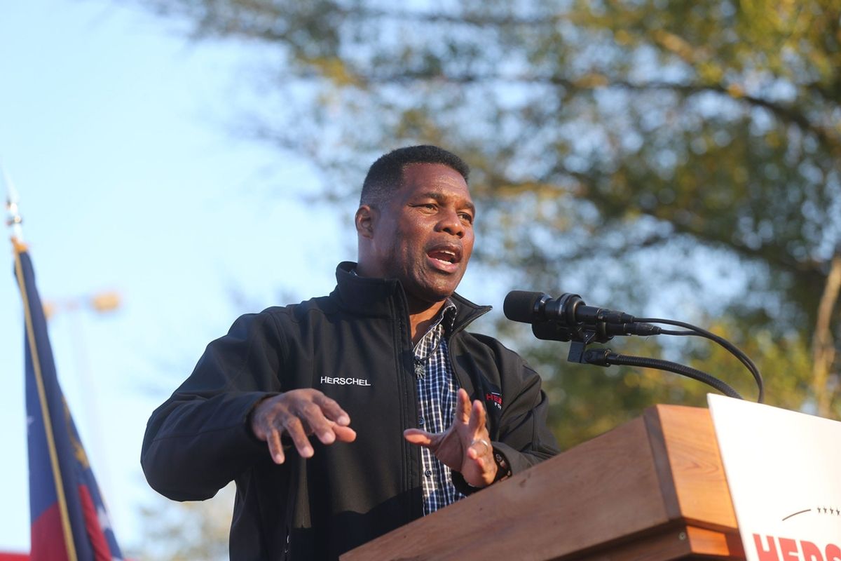 U.S. Senate candidate Herschel Walker speaks during a campaign stop on Thursday November 18, 2022 in the parking lot of Savannah Mall in Savannah Georgia.