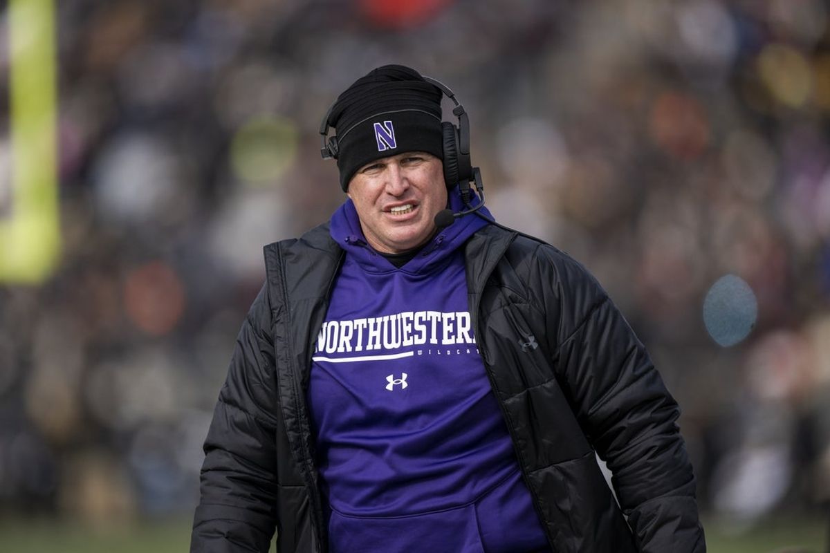 Nov 19, 2022; West Lafayette, Indiana, USA;  Northwestern Wildcats head coach Pat Fitzgerald walks the sidelines during the second quarter against the Purdue Boilermakers at Ross-Ade Stadium. Mandatory Credit: Marc Lebryk-Imagn Images