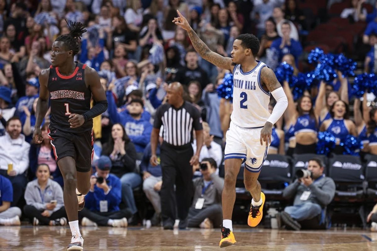 Nov 29, 2023; Newark, New Jersey, USA; Seton Hall Pirates guard Al-Amir Dawes (2) reacts after a basket during the first half in front of Northeastern Huskies guard Masai Troutman (1) at Prudential Center.