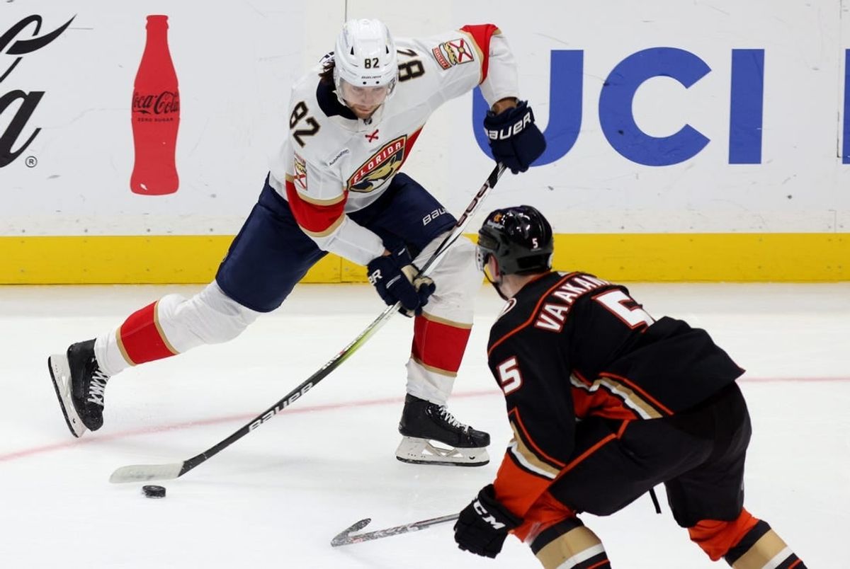 Nov 17, 2023; Anaheim, California, USA; Florida Panthers center Kevin Stenlund (82) shoots against Anaheim Ducks defenseman Urho Vaakanainen (5) during the second period at Honda Center.