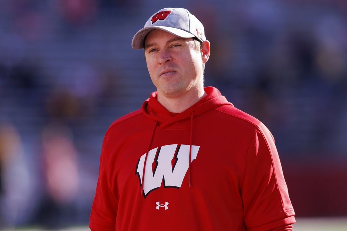 Nov 26, 2022; Madison, Wisconsin, USA;  Wisconsin Badgers interim head coach Jim Leonhard looks on during warmups prior to the game against the Minnesota Golden Gophers at Camp Randall Stadium. Mandatory Credit: Jeff Hanisch-Imagn Images
