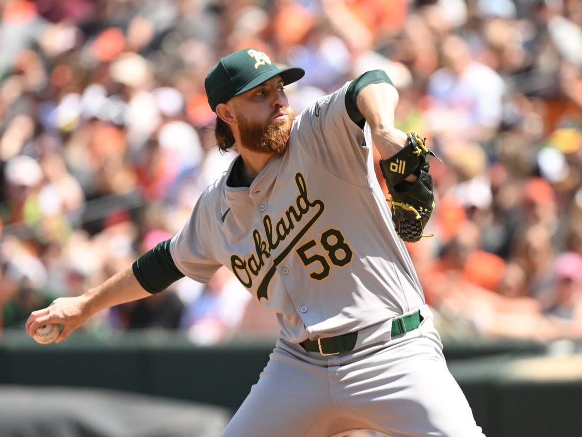 Apr 28, 2024; Baltimore, Maryland, USA;  Oakland Athletics starting pitcher Paul Blackburn (58) delivers a pitch during the first inning against the Baltimore Orioles at Oriole Park at Camden Yards.