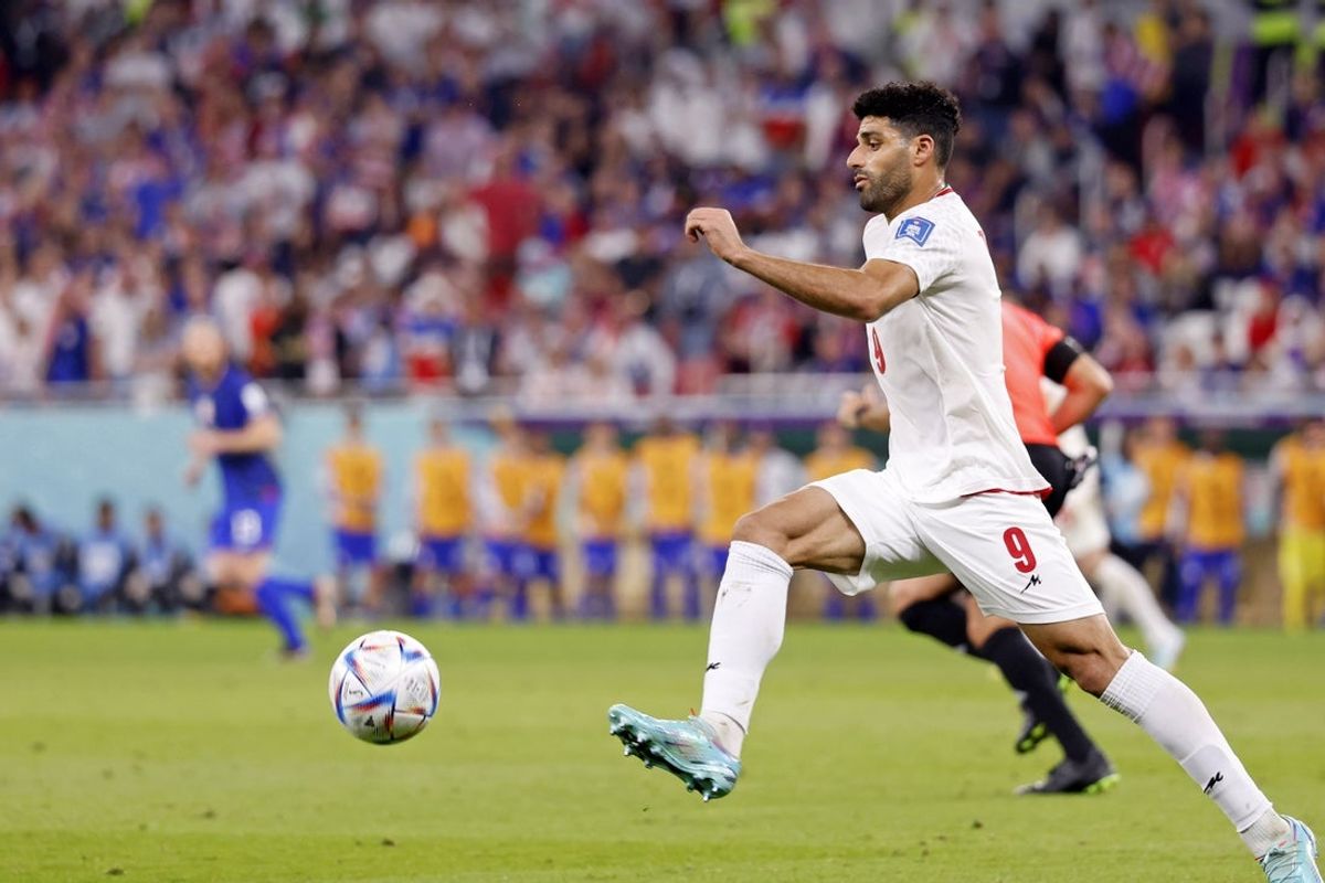 Nov 29, 2022; Doha, Qatar; Iran forward Mehdi Taremi (9) makes a play for the ball during the first half of a group stage match during the 2022 World Cup at Al Thumama Stadium. Mandatory Credit: Yukihito Taguchi-Imagn Images
