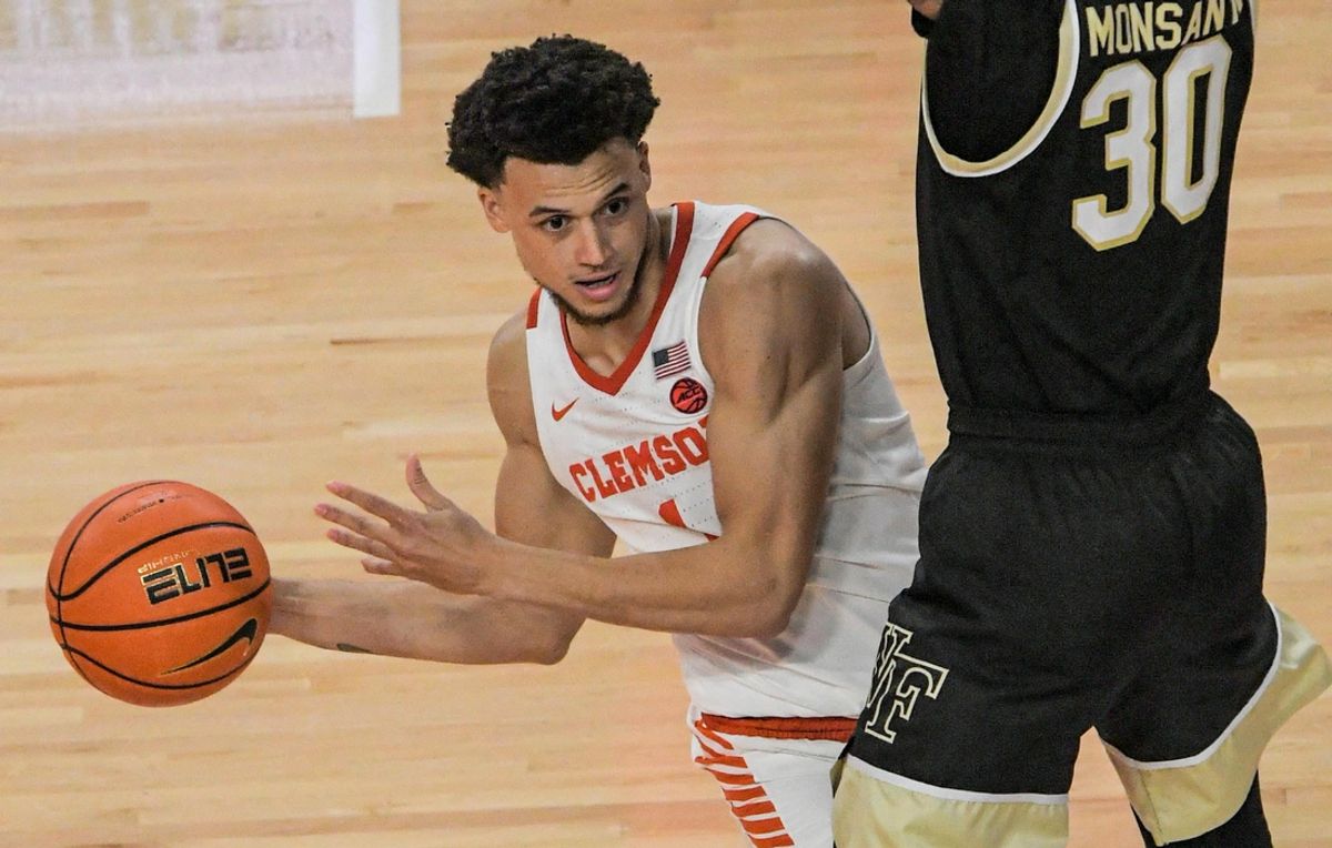 Clemson junior guard Chase Hunter (1) passes around Wake Forest guard Damari Monsanto (30) during the second half at Littlejohn Coliseum Friday, December 2, 2022.

Clemson Basketball Vs Wake Forest University Acc