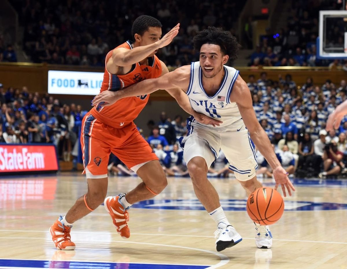 Nov 17, 2023; Durham, North Carolina, USA; Duke Blue Devils guard Jared McCain (0) drives to the basket as Bucknell Bison guard Brandon McCreesh (10) defends during the second half at Cameron Indoor Stadium.