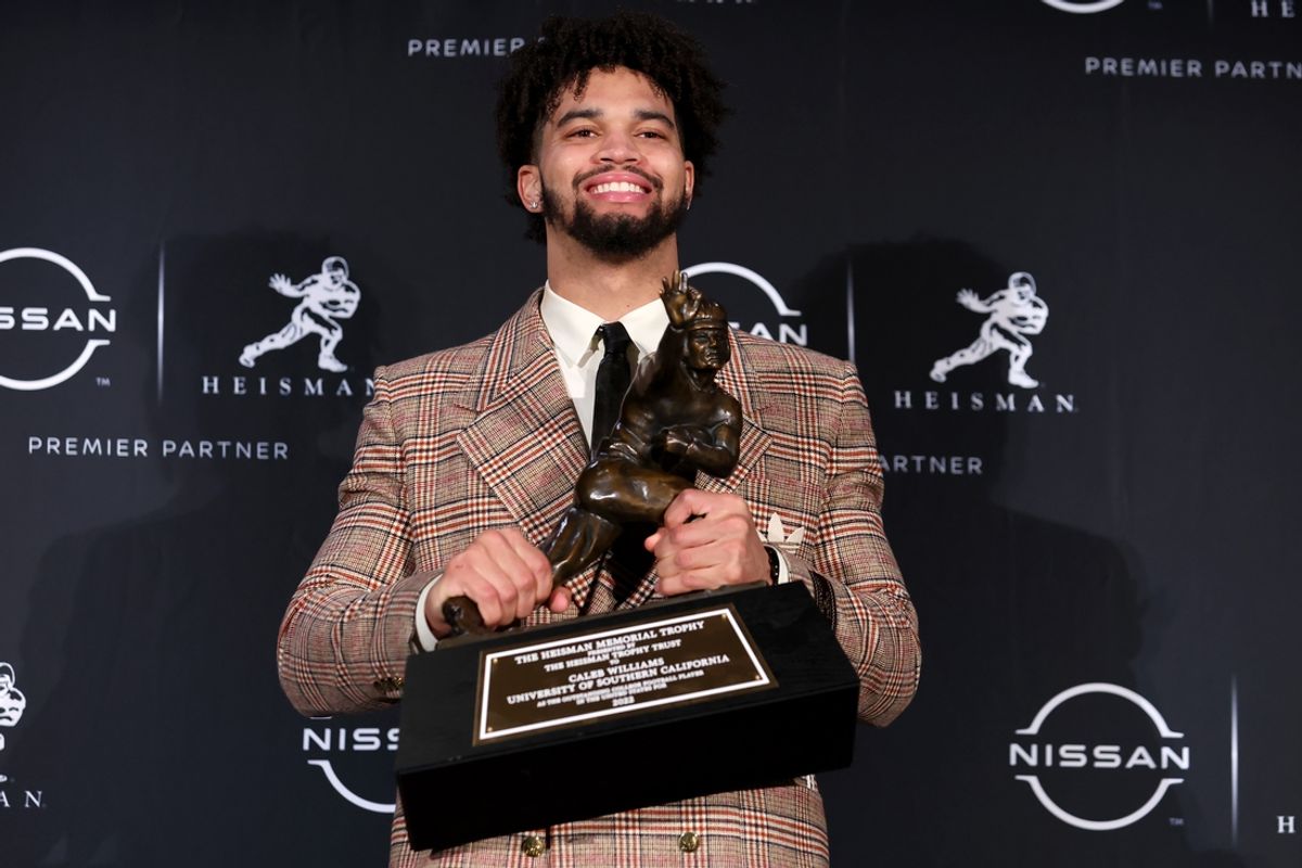 Dec 10, 2022; New York, NY, USA; Southern California quarterback Caleb Williams poses for photos during a press conference in the Astor Ballroom at the New York Marriott Marquis in New York, NY, after winning the 2022 Heisman Trophy. Mandatory Credit: Brad Penner-Imagn Images
