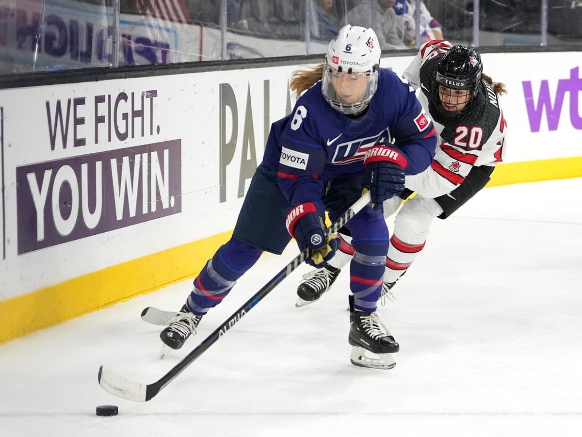 Dec 15, 2022; Henderson, Nevada, USA; Team United States defender Kali Flanagan (6) skates ahead of Team Canada forward Sarah Nurse (20) during the third period of a Rivalry Series women's ice hockey game at Dollar Loan Center. Mandatory Credit: Stephen R. Sylvanie-Imagn Images