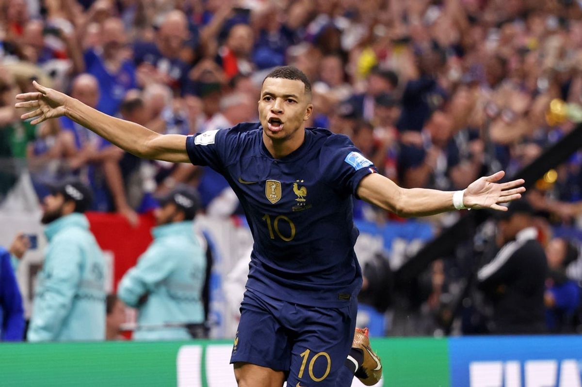 Dec 18, 2022; Lusail, Qatar; France forward Kylian Mbappe (10) celebrates after scoring a goal against Argentina on a penalty kick for his third goal of the match during extra time of the 2022 World Cup final at Lusail Stadium. Mandatory Credit: Yukihito Taguchi-Imagn Images