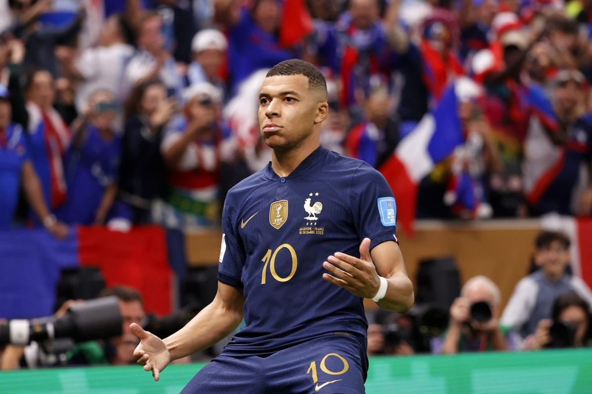 Dec 18, 2022; Lusail, Qatar; France forward Kylian Mbappe (10) celebrates after scoring a goal against Argentina on a penalty kick for his third goal of the match during extra time of the 2022 World Cup final at Lusail Stadium. Mandatory Credit: Yukihito Taguchi-Imagn Images