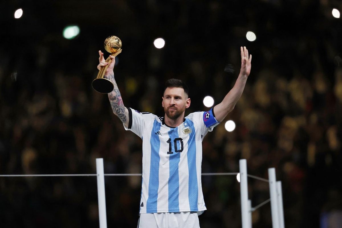 Dec 18, 2022; Lusail, Qatar; Argentina forward Lionel Messi (10) holds the golden ball trophy after winning the 2022 World Cup final against France at Lusail Stadium. Mandatory Credit: Yukihito Taguchi-Imagn Images