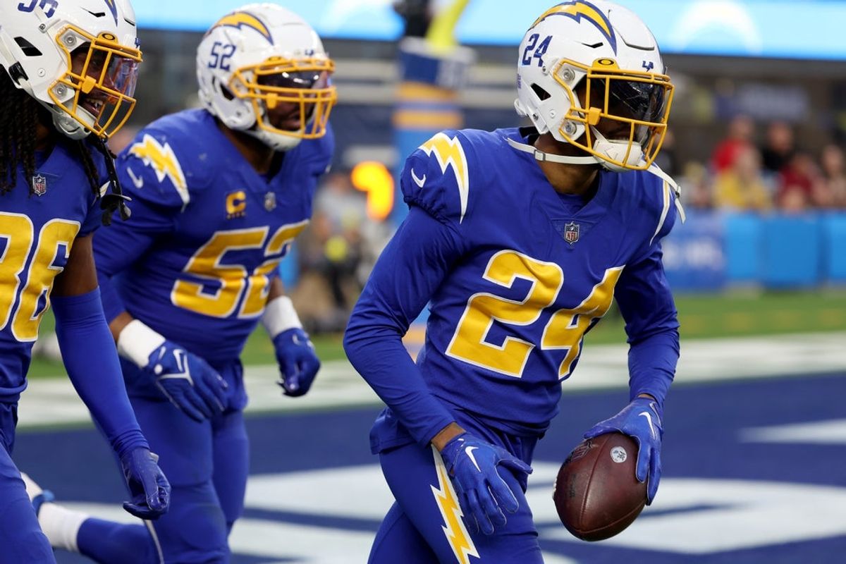 Dec 18, 2022; Inglewood, California, USA; Los Angeles Chargers safety Nasir Adderley (24) reacts after intercepting a pass during the third quarter against the Tennessee Titans at SoFi Stadium. Mandatory Credit: Kiyoshi Mio-Imagn Images