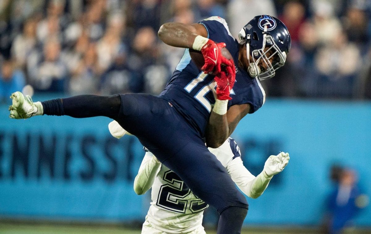 Tennessee Titans wide receiver Treylon Burks (16) pulls in a catch over Dallas Cowboys cornerback C.J. Goodwin (29) during the fourth quarter at Nissan Stadium Thursday, Dec. 29, 2022, in Nashville, Tenn.

Nfl Dallas Cowboys At Tennessee Titans