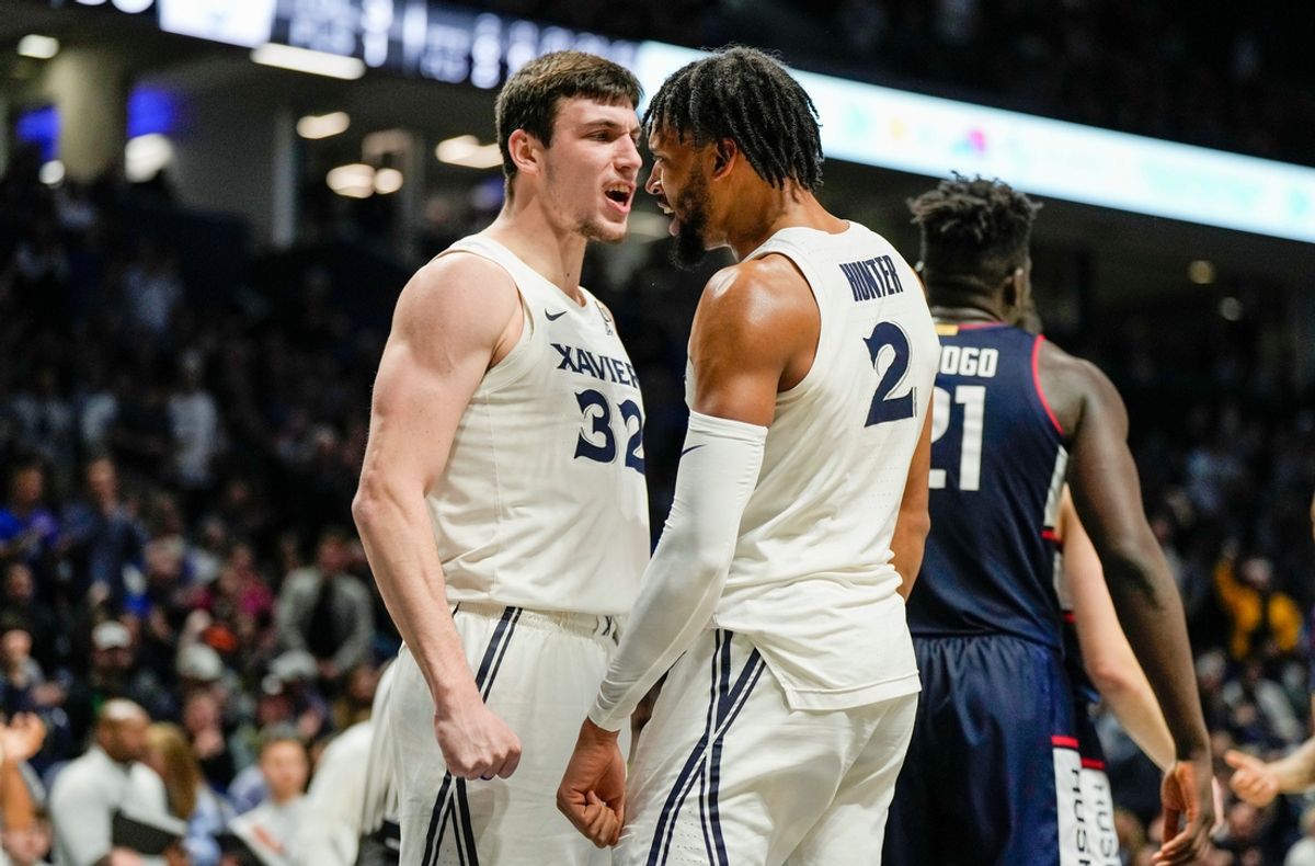 Xavier Musketeers forward Zach Freemantle (32) and  Jerome Hunter (2) celebrate after Hunter is fouled by the Connecticut Huskies Saturday, December 31, 2022 at the Cintas Center. The Musketeers upset the Huskies 83-73.

Xavier Uconn10