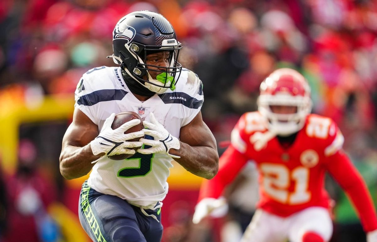 Dec 24, 2022; Kansas City, Missouri, USA; Seattle Seahawks running back Kenneth Walker III (9) runs the ball during the second half against the Kansas City Chiefs at GEHA Field at Arrowhead Stadium. Mandatory Credit: Jay Biggerstaff-Imagn Images