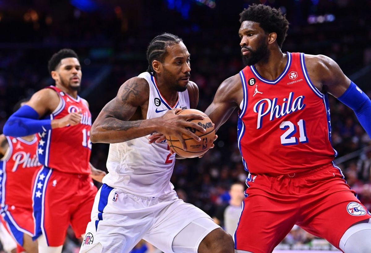 Dec 23, 2022; Philadelphia, Pennsylvania, USA; Los Angeles Clippers forward Kawhi Leonard (2) drives against Philadelphia 76ers center Joel Embiid (21) in the third quarter at Wells Fargo Center. Mandatory Credit: Kyle Ross-USA TODAY Sports