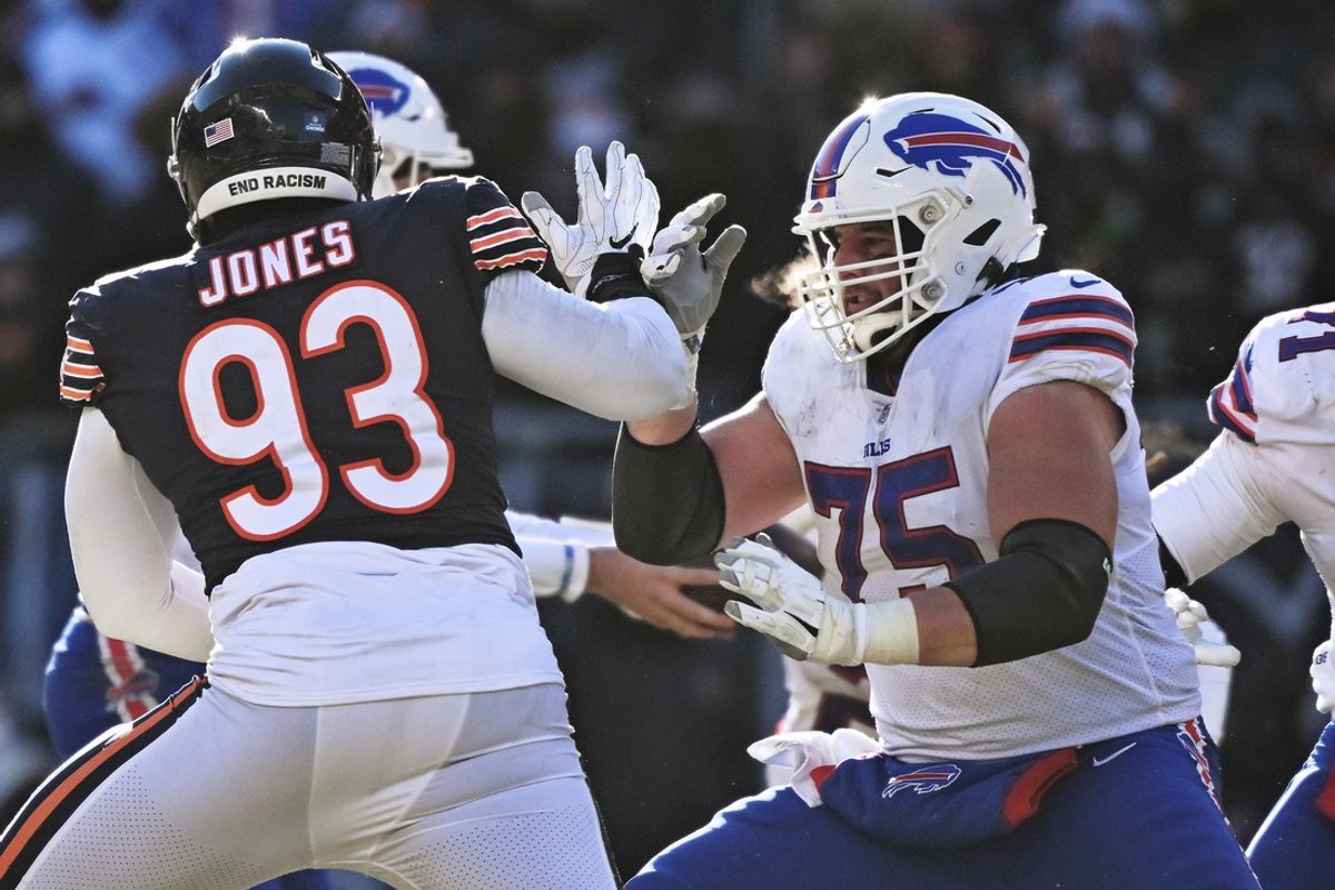 Dec 24, 2022; Chicago, Illinois, USA;  Buffalo Bills offensive lineman Greg Van Roten (75) blocks against the Chicago Bears at Soldier Field. Mandatory Credit: Jamie Sabau-USA TODAY Sports