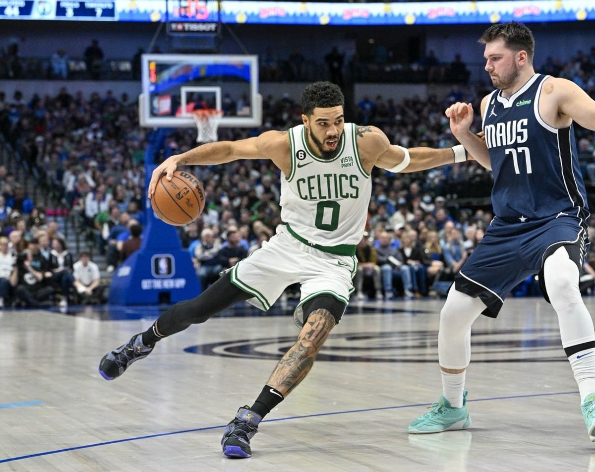 Boston Celtics forward Jayson Tatum (0) and Dallas Mavericks guard Luka Doncic (77) in action during the game between the Dallas Mavericks and the Boston Celtics at the American Airlines Center. Mandatory Credit: Jerome Miron-USA TODAY Sports