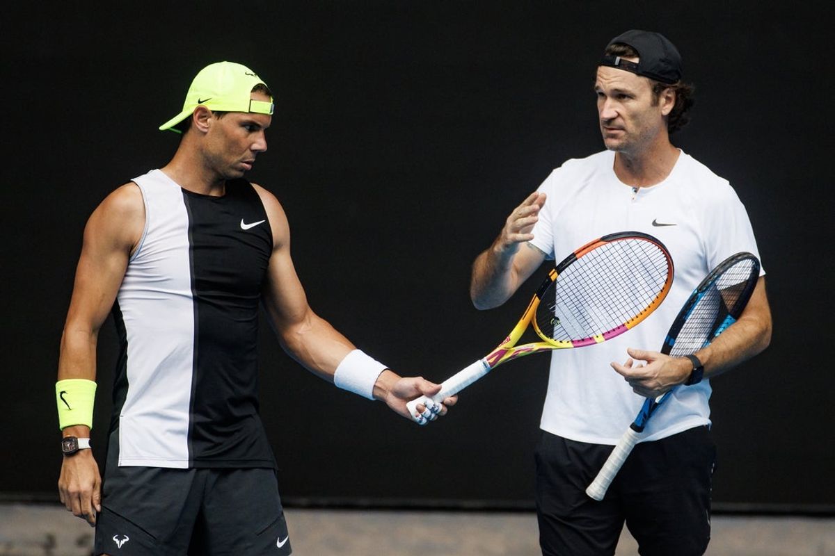 Jan 13, 2023; Melbourne, Victoria, Australia; Rafael Nadal of Spain talks with his coach, Carlos Moya, during a practice session on Rod Laver Arena  at Melbourne Park. Mandatory Credit: Mike Frey-Imagn Images