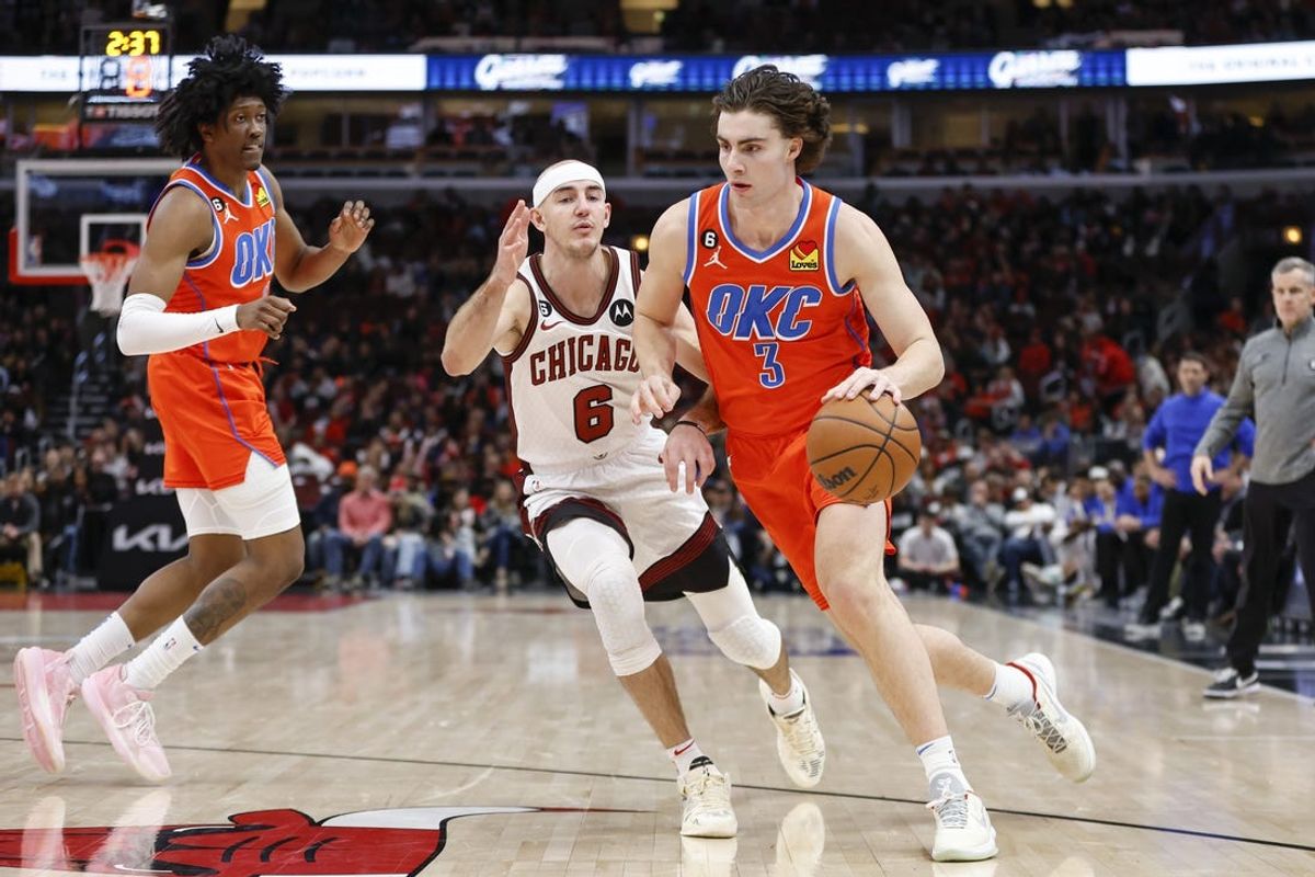 Jan 13, 2023; Chicago, Illinois, USA; Oklahoma City Thunder guard Josh Giddey (3) drives to the basket against Chicago Bulls guard Alex Caruso (6) during the second half at United Center. Mandatory Credit: Kamil Krzaczynski-USA TODAY Sports