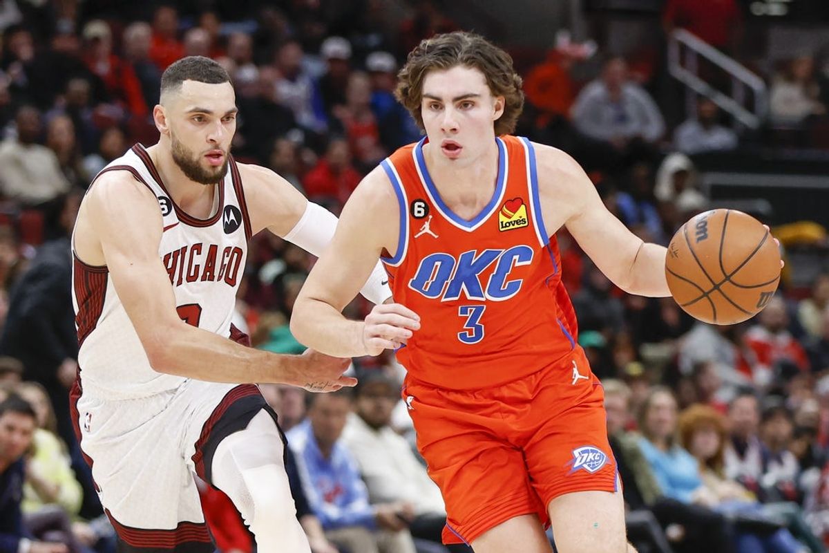 Oklahoma City Thunder guard Josh Giddey (3) drives to the basket past Chicago Bulls guard Zach LaVine (8) during the second half at United Center. Mandatory Credit: Kamil Krzaczynski-USA TODAY Sports
