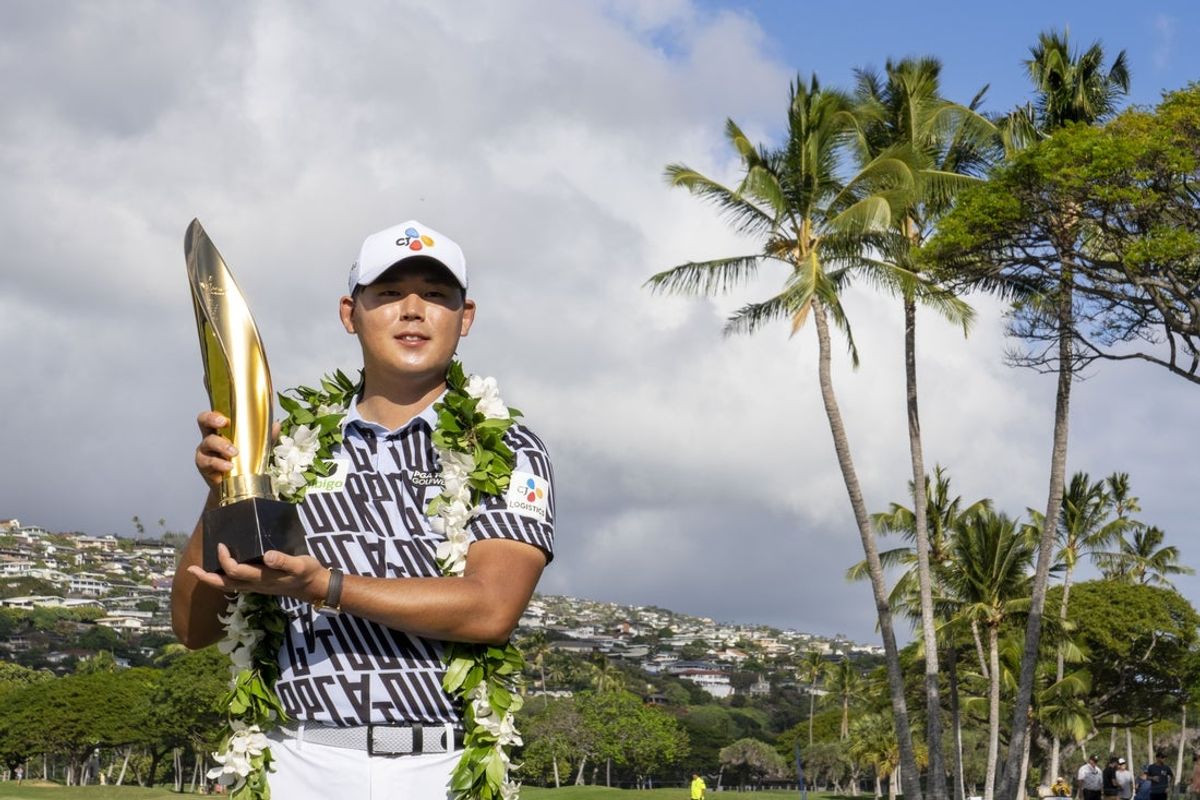 January 15, 2023; Honolulu, Hawaii, USA; Si Woo Kim poses with the trophy during the final round of the Sony Open in Hawaii golf tournament at Waialae Country Club. Mandatory Credit: Kyle Terada-Imagn Images