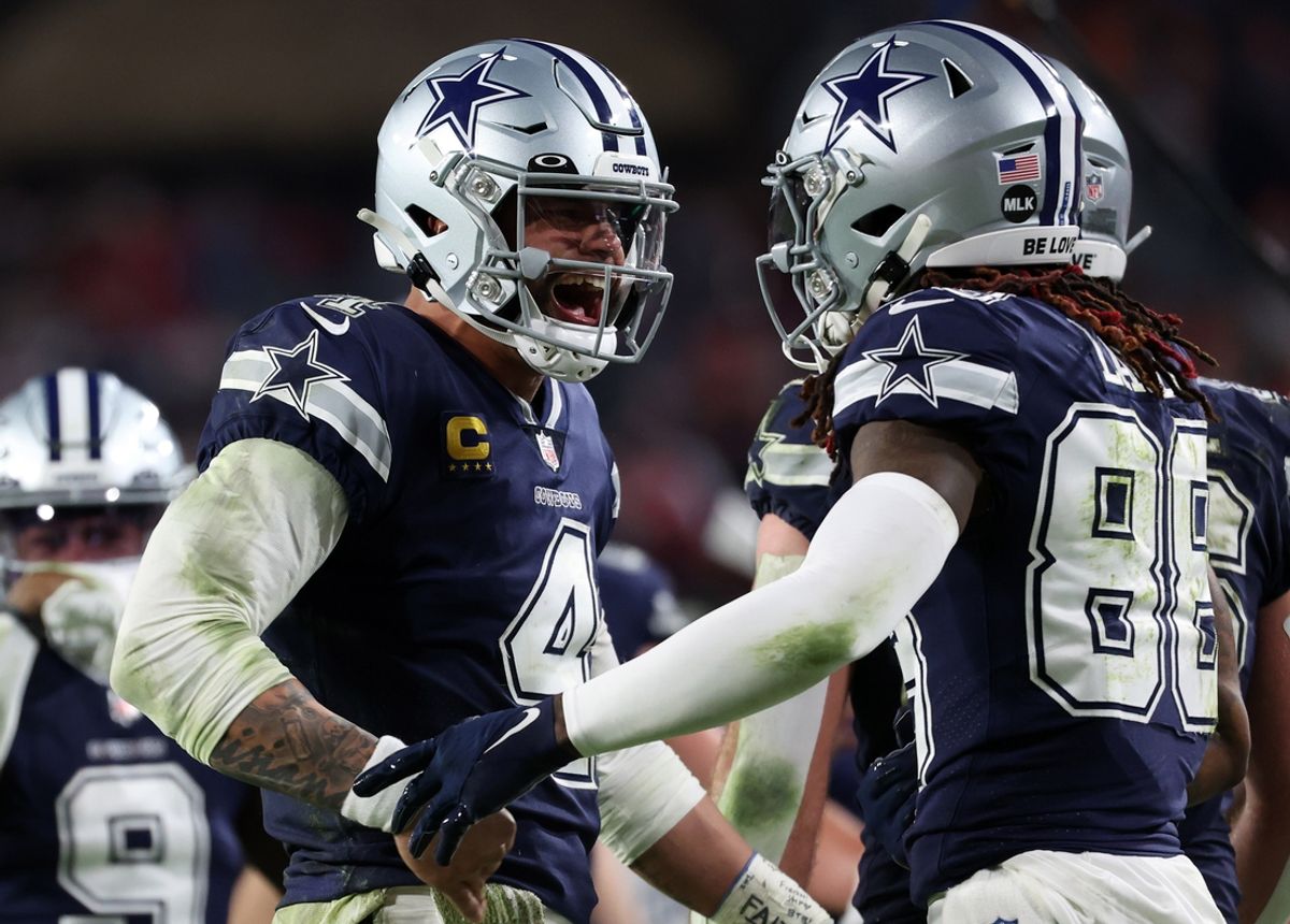 Jan 16, 2023; Tampa, Florida, USA; Dallas Cowboys quarterback Dak Prescott (4) reacts with wide receiver CeeDee Lamb (88) after throwing a touchdown pass against the Tampa Bay Buccaneers in the second half during the wild card game at Raymond James Stadium. Mandatory Credit: Kim Klement-USA TODAY Sports