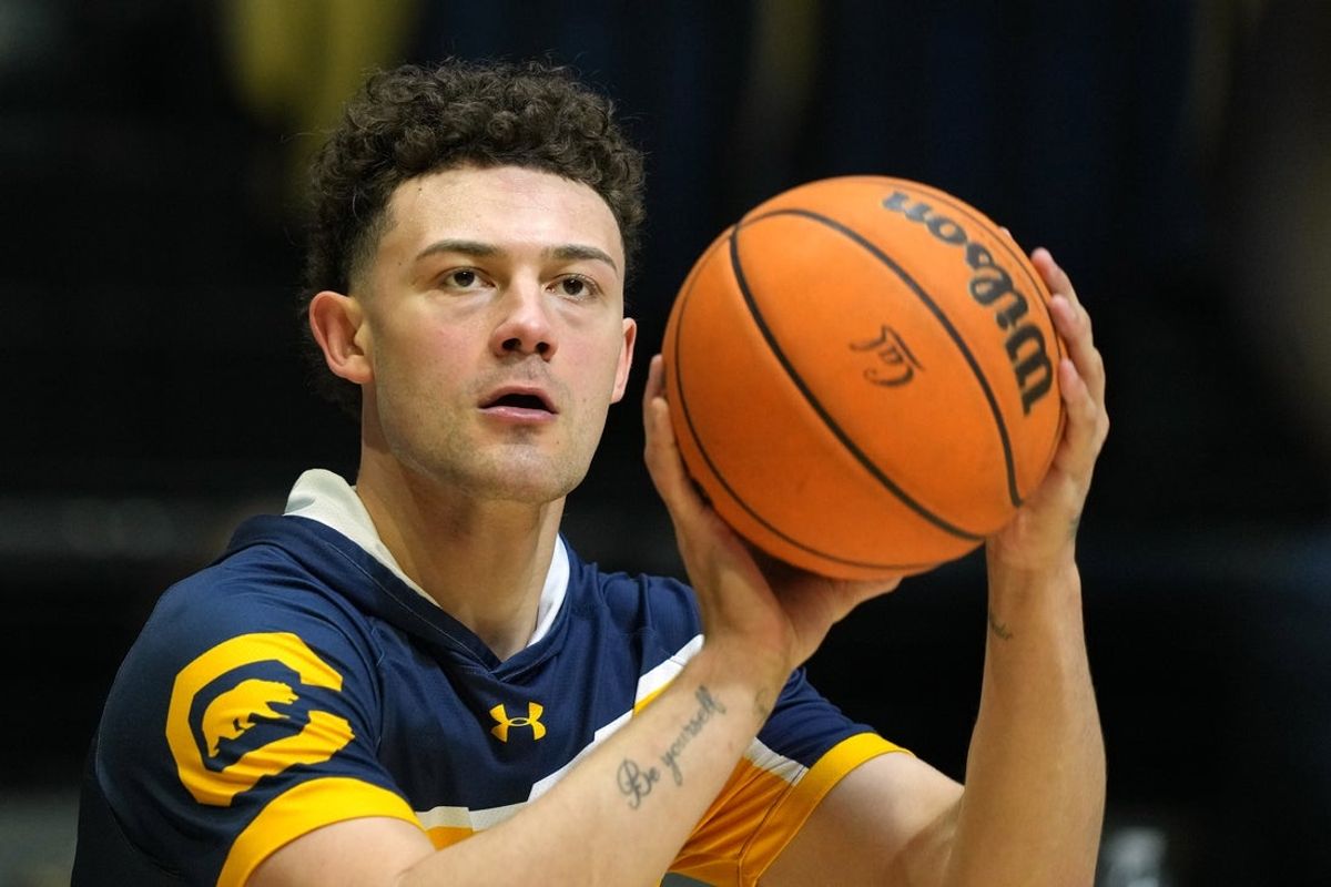 Jan 22, 2023; Berkeley, California, USA; California Golden Bears guard Devin Askew (55) warms up before the game against the Oregon State Beavers at Haas Pavilion. Mandatory Credit: Darren Yamashita-Imagn Images