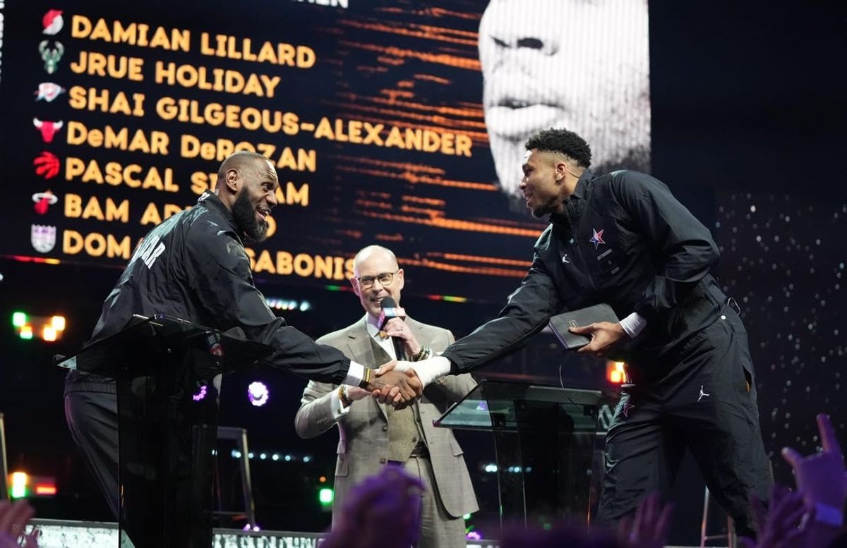 Feb 19, 2023; Salt Lake City, UT, USA; Team LeBron forward LeBron James (left) shakes hands with Team Giannis forward Giannis Antetokounmpo (right) after completing the draft before the 2023 NBA All-Star Game at Vivint Arena.