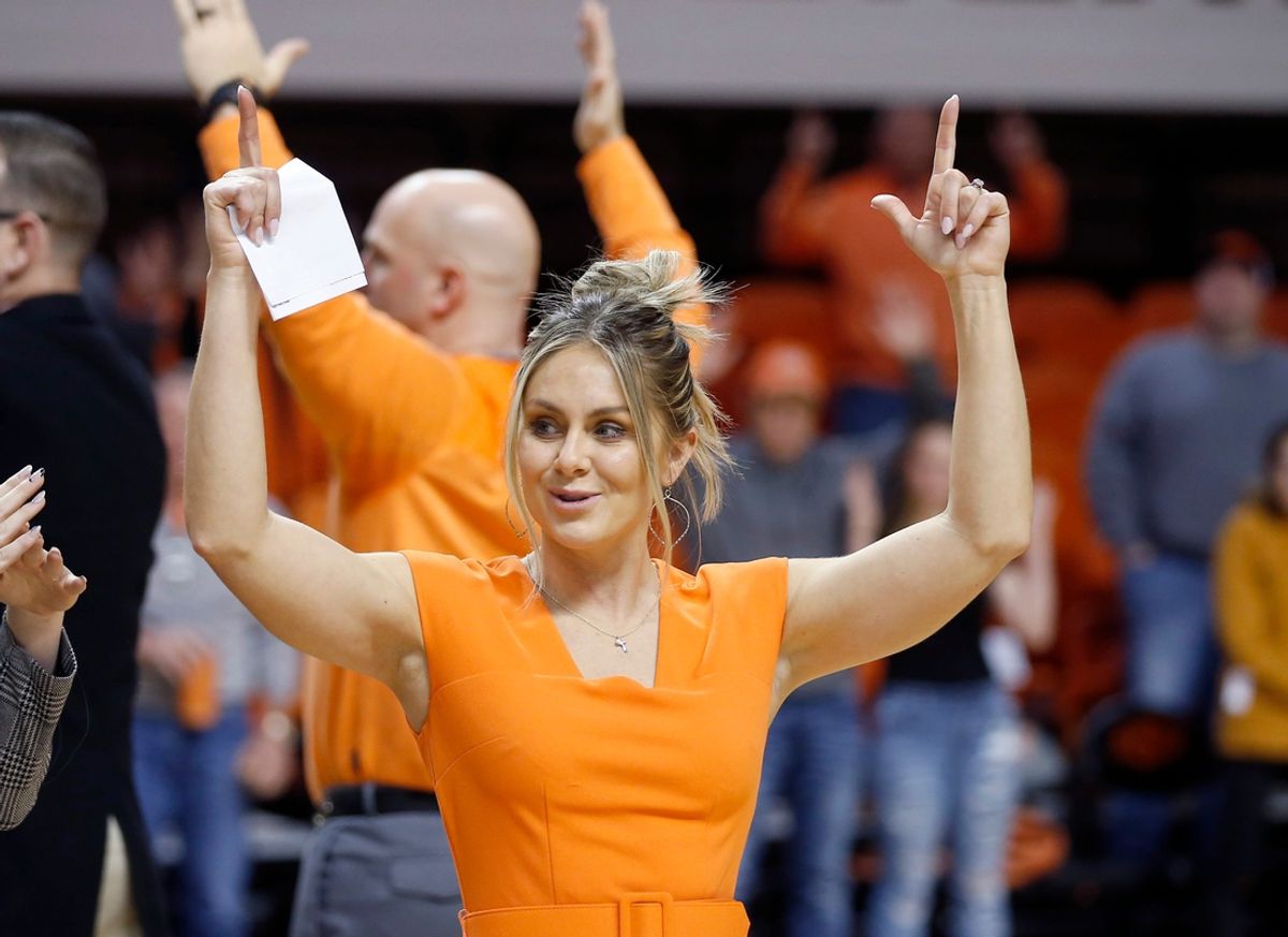 Oklahoma State head coach Jacie Hoyt sings the alma mater following the college women's basketball game between the Oklahoma State Cowgirls and the TCU Horned Frogs at Gallagher-Iba Arena in Stillwater, Okla., Saturday, Jan.14, 2023.

Osu V Tcu Wbb