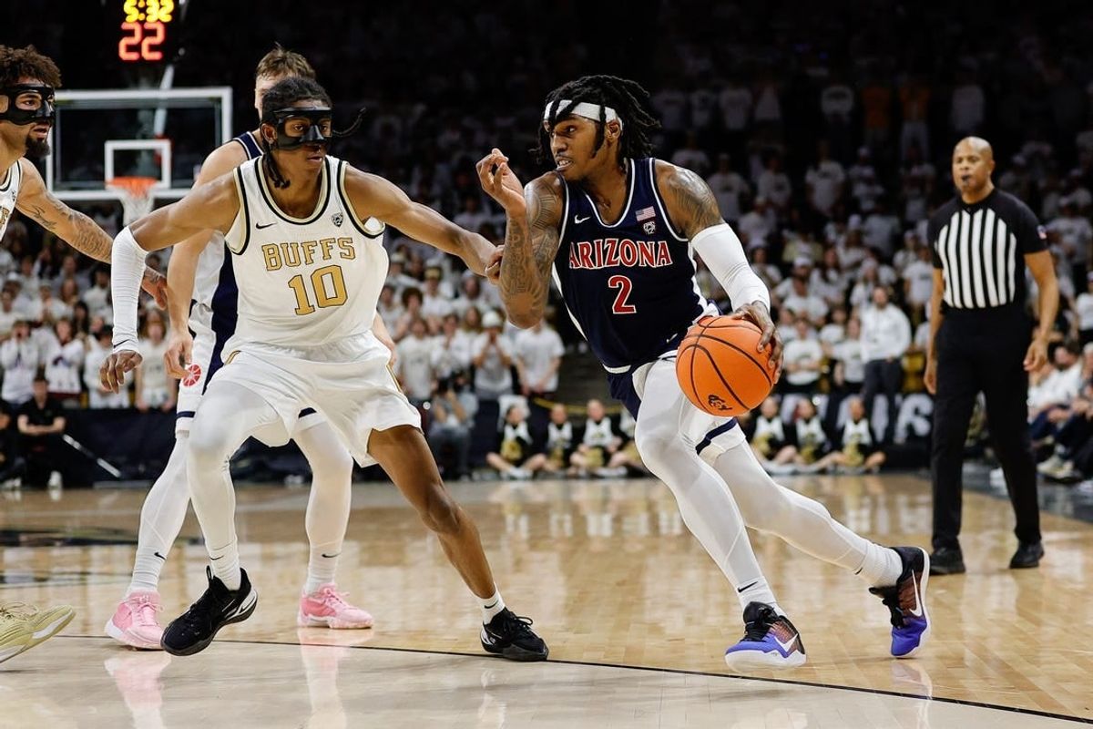 Feb 10, 2024; Boulder, Colorado, USA; Arizona Wildcats guard Caleb Love (2) drives to the basket against Colorado Buffaloes forward Cody Williams (10) in the first half at CU Events Center.