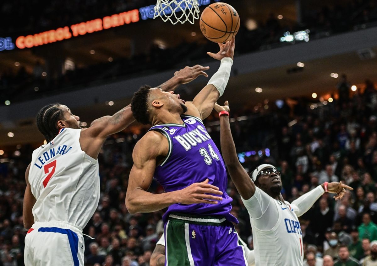 Feb 2, 2023; Milwaukee, Wisconsin, USA; Milwaukee Bucks forward Giannis Antetokounmpo (34) takes a shot against Los Angeles Clippers guard Kawhi Leonard (2) in the fourth quarter at Fiserv Forum. Mandatory Credit: Benny Sieu-Imagn Images