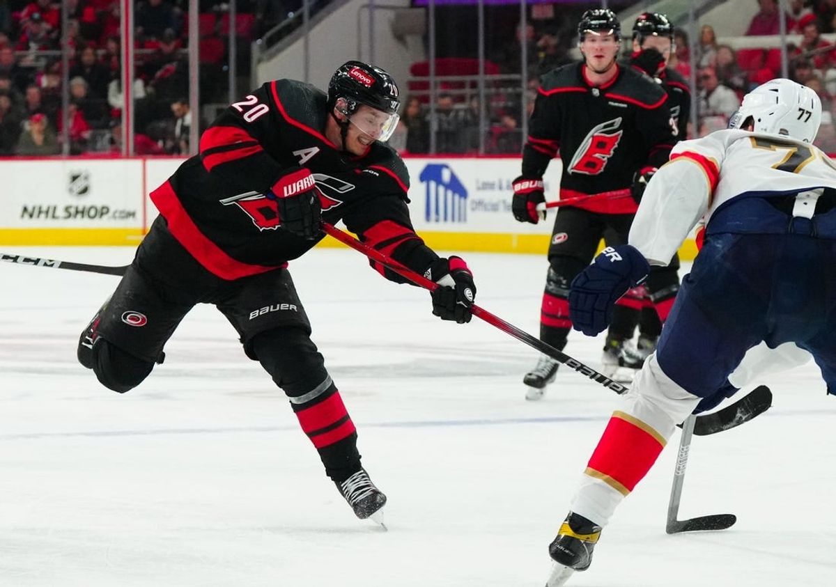 Feb 22, 2024; Raleigh, North Carolina, USA; Carolina Hurricanes center Sebastian Aho (20) takes a shot against the Florida Panthers during the third period at PNC Arena.