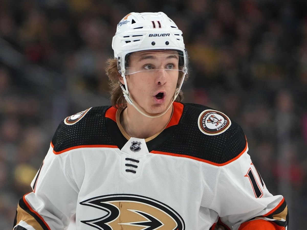 Feb 12, 2023; Las Vegas, Nevada, USA; Anaheim Ducks center Trevor Zegras (11) talks to a teammate before a face off against the Vegas Golden Knights during the first period at T-Mobile Arena. Mandatory Credit: Stephen R. Sylvanie-Imagn Images
