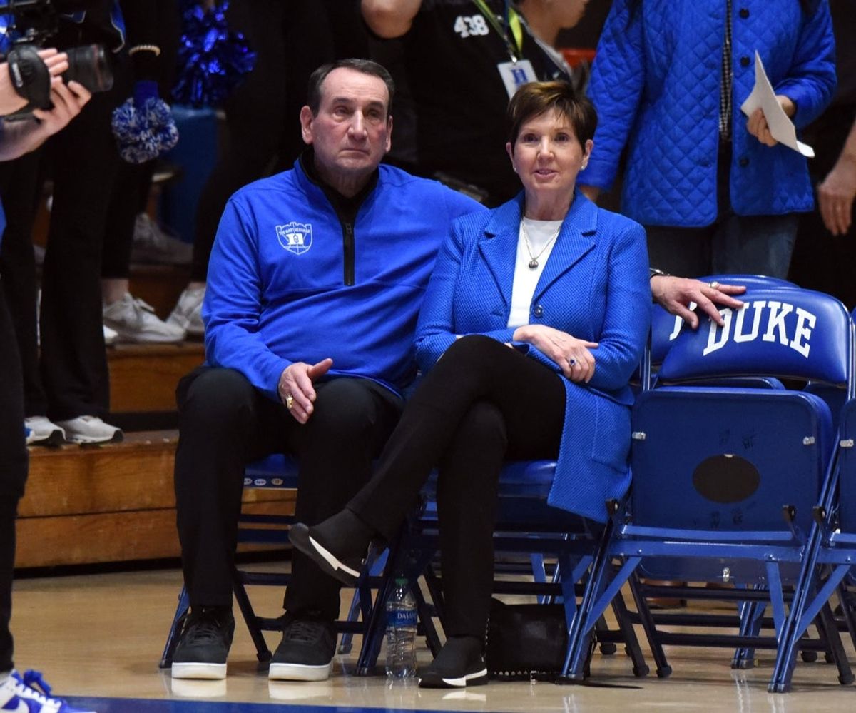 Feb 14, 2023; Durham, North Carolina, USA; Former Duke Blue Devils head coach Mike Krzyzewski (left) and wife Mickie watch the Notre Dame Fighting Irish and Duke Blue Devils warmup at Cameron Indoor Stadium. Mandatory Credit: Rob Kinnan-Imagn Images