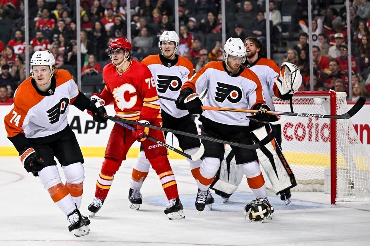 Dec 31, 2023; Calgary, Alberta, CAN; Philadelphia Flyers goaltender Samuel Ersson (33) pulls off his mask during the third period in a game against the Calgary Flames at Scotiabank Saddledome.