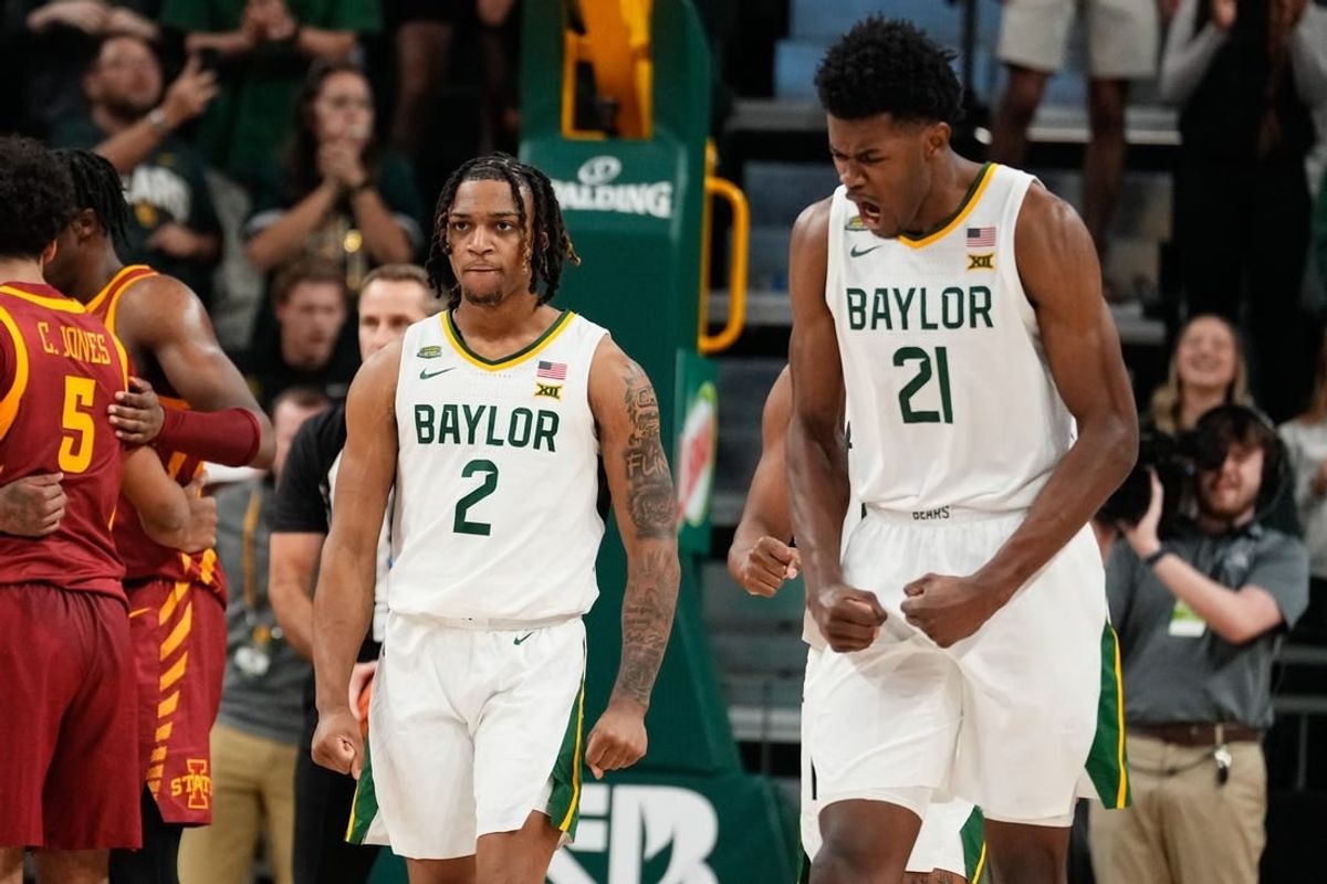 Feb 3, 2024; Waco, Texas, USA; Baylor Bears guard Jayden Nunn (2) and Baylor Bears center Yves Missi (21) reacts after Baylor Bears guard Jayden Nunn (2) scores and is fouled in the closing moments against the  Iowa State Cyclones at Paul and Alejandra Foster Pavilion.