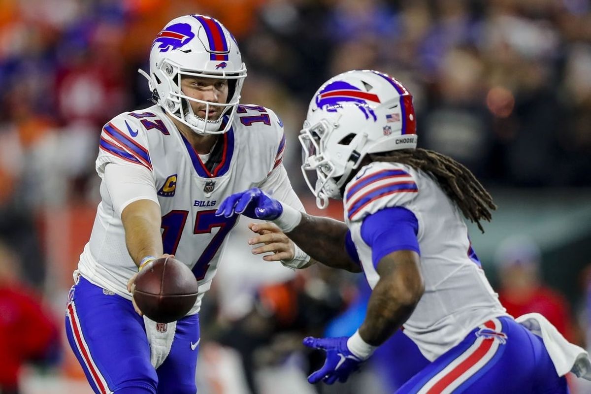 Nov 5, 2023; Cincinnati, Ohio, USA; Buffalo Bills quarterback Josh Allen (17) hands the ball off to running back James Cook (4) in the first half against the Cincinnati Bengals at Paycor Stadium.
