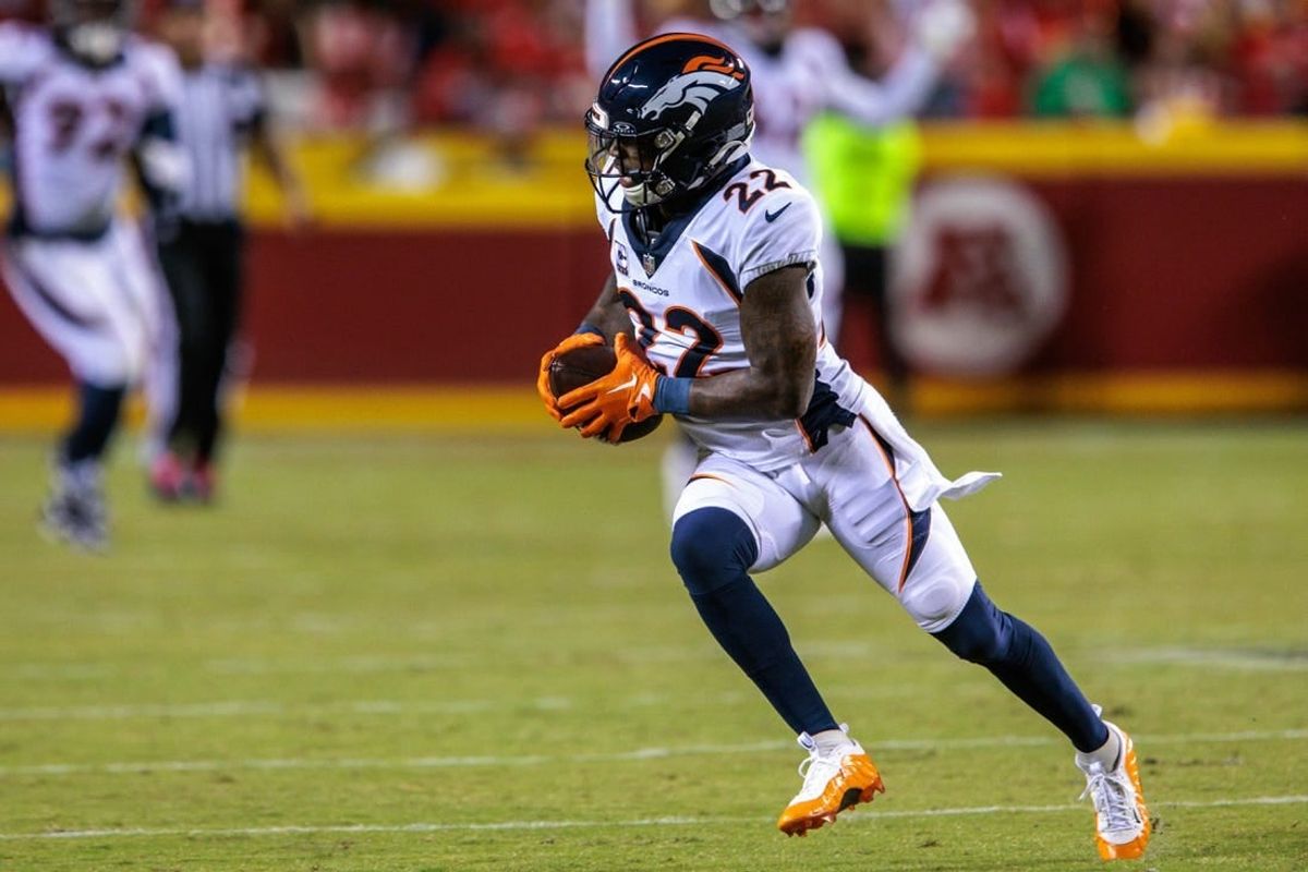 Oct 12, 2023; Kansas City, Missouri, USA; Denver Broncos safety Kareem Jackson (22) runs the ball after an interception during the second quarter against the Kansas City Chiefs at GEHA Field at Arrowhead Stadium.
