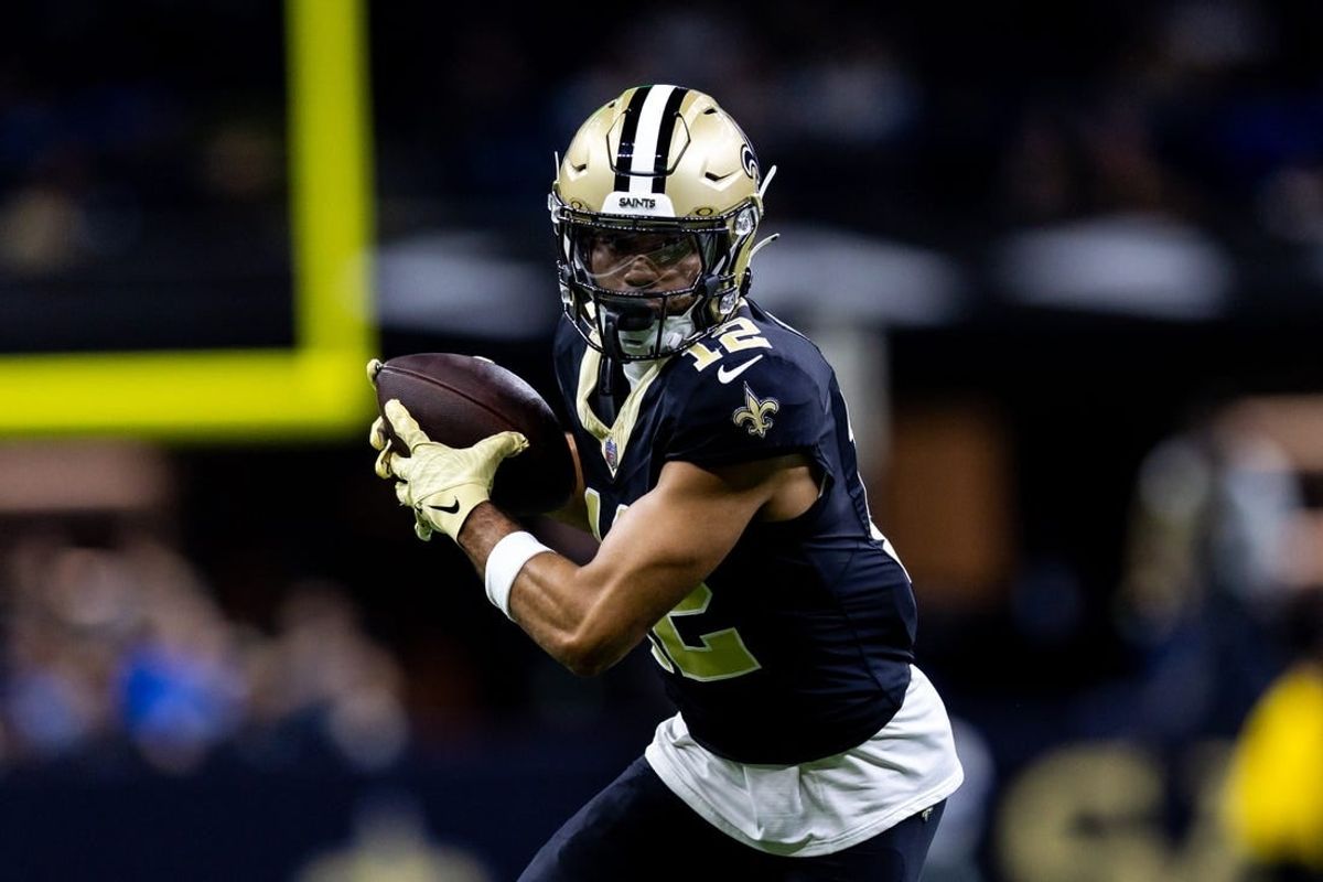 Dec 3, 2023; New Orleans, Louisiana, USA; New Orleans Saints wide receiver Chris Olave (12) catches a pass against the Detroit Lions during the first half at the Caesars Superdome.