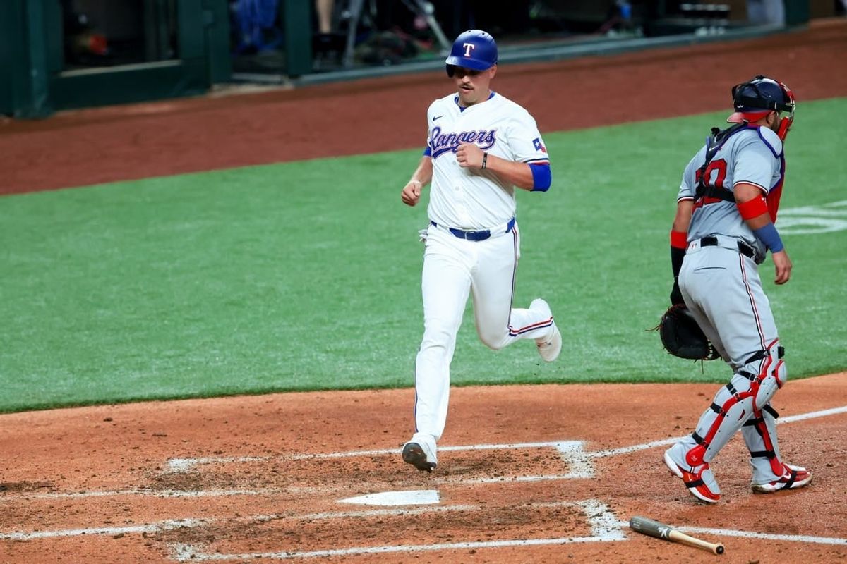Apr 30, 2024; Arlington, Texas, USA;  Texas Rangers first base Nathaniel Lowe (30) scores during the fourth inning against the Washington Nationals at Globe Life Field.