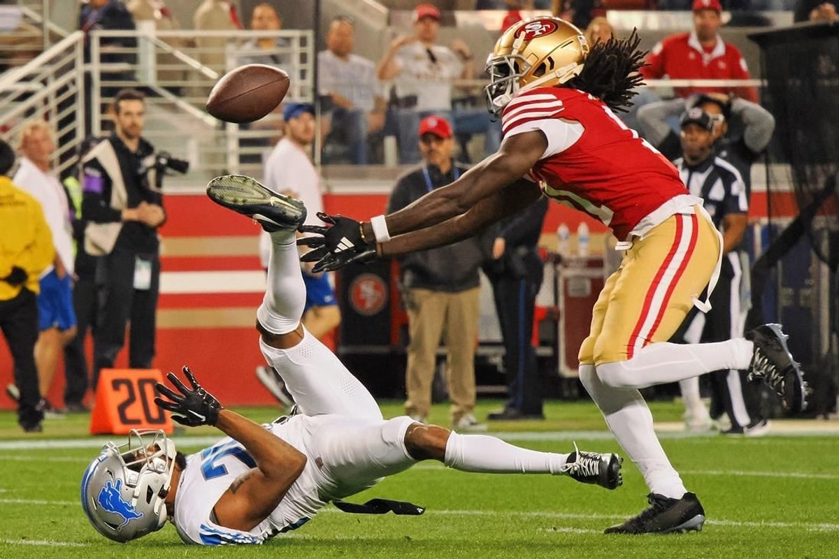 Jan 28, 2024; Santa Clara, California, USA; San Francisco 49ers wide receiver Brandon Aiyuk (11) reaches for a ball that bounced off the face mask of Detroit Lions cornerback Kindle Vildor (29) during the second half of the NFC Championship football game at Levi's Stadium.
