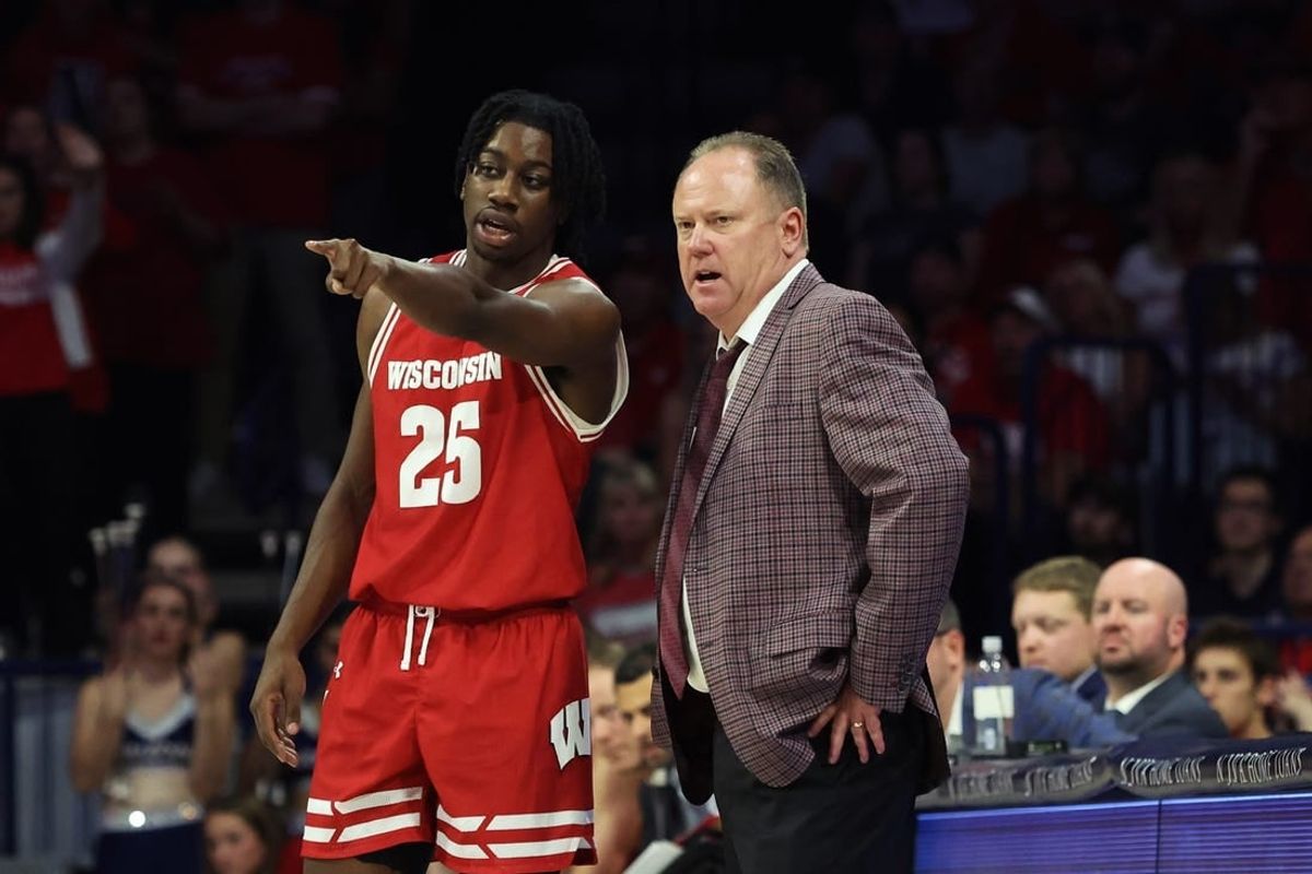 Dec 9, 2023; Tucson, Arizona, USA; Wisconsin Badgers guard John Blackwell (25) talks to Wisconsin Badgers head coach Greg Gard during the second half at McKale Center.
