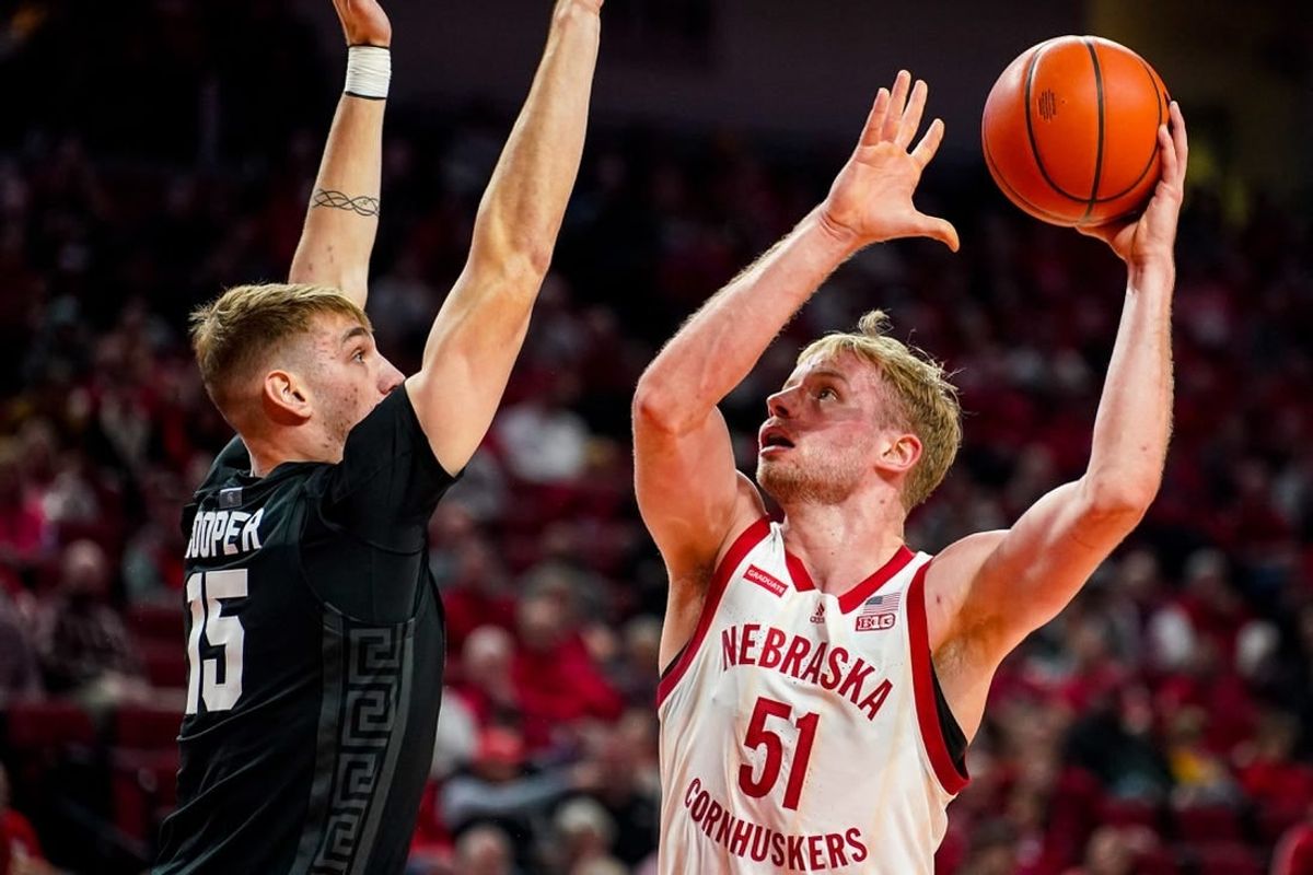 Dec 10, 2023; Lincoln, Nebraska, USA; Nebraska Cornhuskers forward Rienk Mast (51) shoots the ball against Michigan State Spartans center Carson Cooper (15) during the first half at Pinnacle Bank Arena.